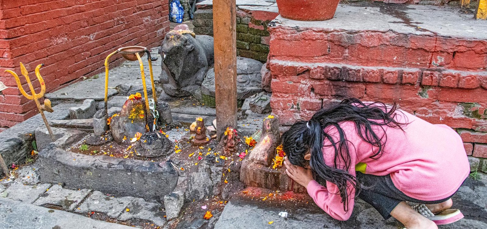 The art institute of chicago returned a 13th-century Chaturmukhi Sivalinga to Nepal. But the institute still prominently displays a 400-year-old necklace of Kathmandu’s Goddess Taleju Bhavani, stolen nearly five decades ago, as a centerpiece of its Art of Asia department in Gallery 141, alongside other Nepali religious antiquities. The case for its return appears straightforward, as the necklace, studded with semi-precious stones and inlaid with Ashtamatrika (the Eight Mother Goddesses) bears an inscription identifying it as the property of King Pratap Malla, who ruled Kathmandu from 1641 to 1674. In May 2022, the Nepali Embassy in Washington D.C. sent the Institute a letter of request for repatriation for the necklace, which it has held for three decades. The Institute replied that the piece was gifted by the US-based Alsdorf Foundation and cannot be returned without definitive proof of origin.  Sweta Gyanu Baniya, an assistant professor at Virginia Tech University’s Center for Humanities, decided to visit the necklace in person with her husband after hearing about it from friends. She later reflected, “When I saw the necklace displayed as a mere object for onlookers who might not know its deep importance to a Nepali Hindu, I started to cry. I joined my hands together in prayer, mumbling to myself, ‘This necklace doesn’t belong here.’ The marks of century-long vermilion powder were still there, signifying that this piece was worshiped as a part of Taleju Bhavani and probably worn by the Goddess herself. Seeing the vermilion deeply moved me, because for the centuries until it was lost, this was part of the Goddess. So many sentiments, religious beliefs, and cultural values are attached to this necklace.”  With strong sentiments, she circulated photos and a video questioning why and how the necklace came to be in the museum. Public outcry grew, and Ms. Baniya later wrote a case study for her students’ degree course to continue the discussion. Despite her best efforts and those of activists and journalists, the Institute remains silent on the matter. Hinduism Today contacted the Institute in early 2026 for their current stance on the issue. Their response via email, “We are committed to preserving and celebrating Nepal’s rich cultural heritage and are always interested in learning more about the objects in our care. We are in communication with the Government of Nepal and will continue to collaborate with them directly.” The Embassy of Nepal in Washington D.C., when asked if communication is indeed happening, replied that they do not have any updates regarding the case at this time.